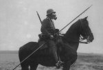 mounted-german-soldier-in-a-gas-mask-and-carrying-a-lance-during-ww1.jpg